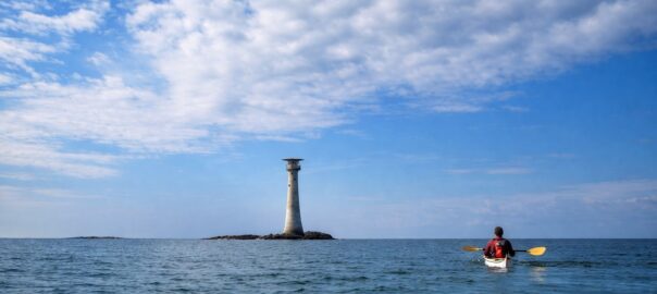 Sea kayak approaching the Smalls Lighthouse off Pembrokeshire