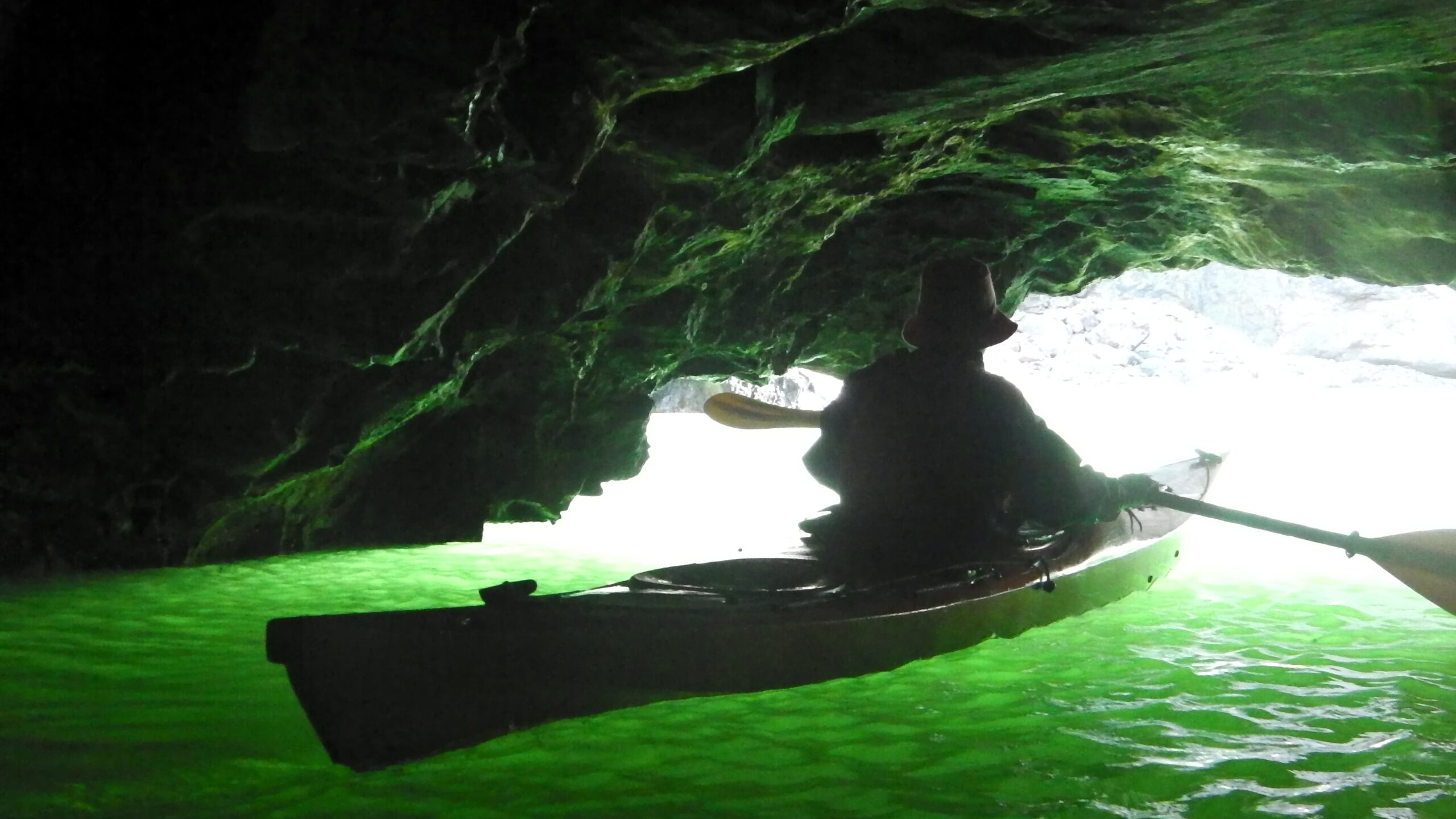 Sea kayak entering the Witches Cauldron in Pembrokeshire