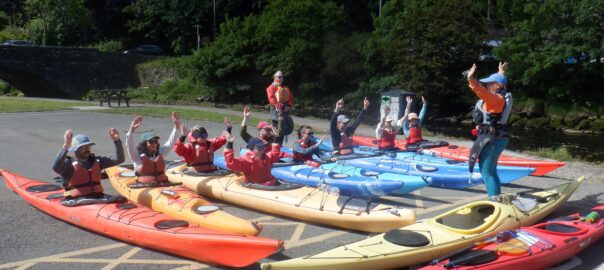 Guests enjoying a sea kayaking adventure with Mayberry Kayaking in Pembrokeshire.
