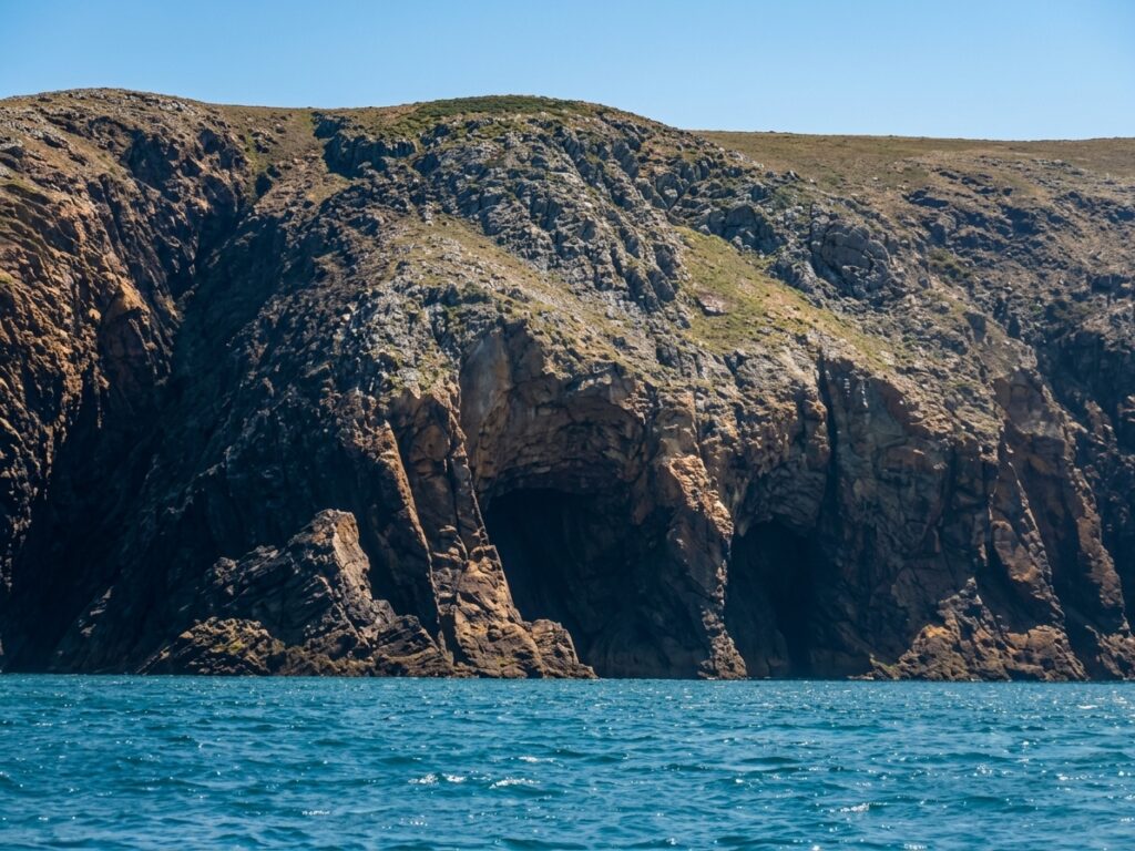Sea kayakers approaching Ramsey Island in Pembrokeshire